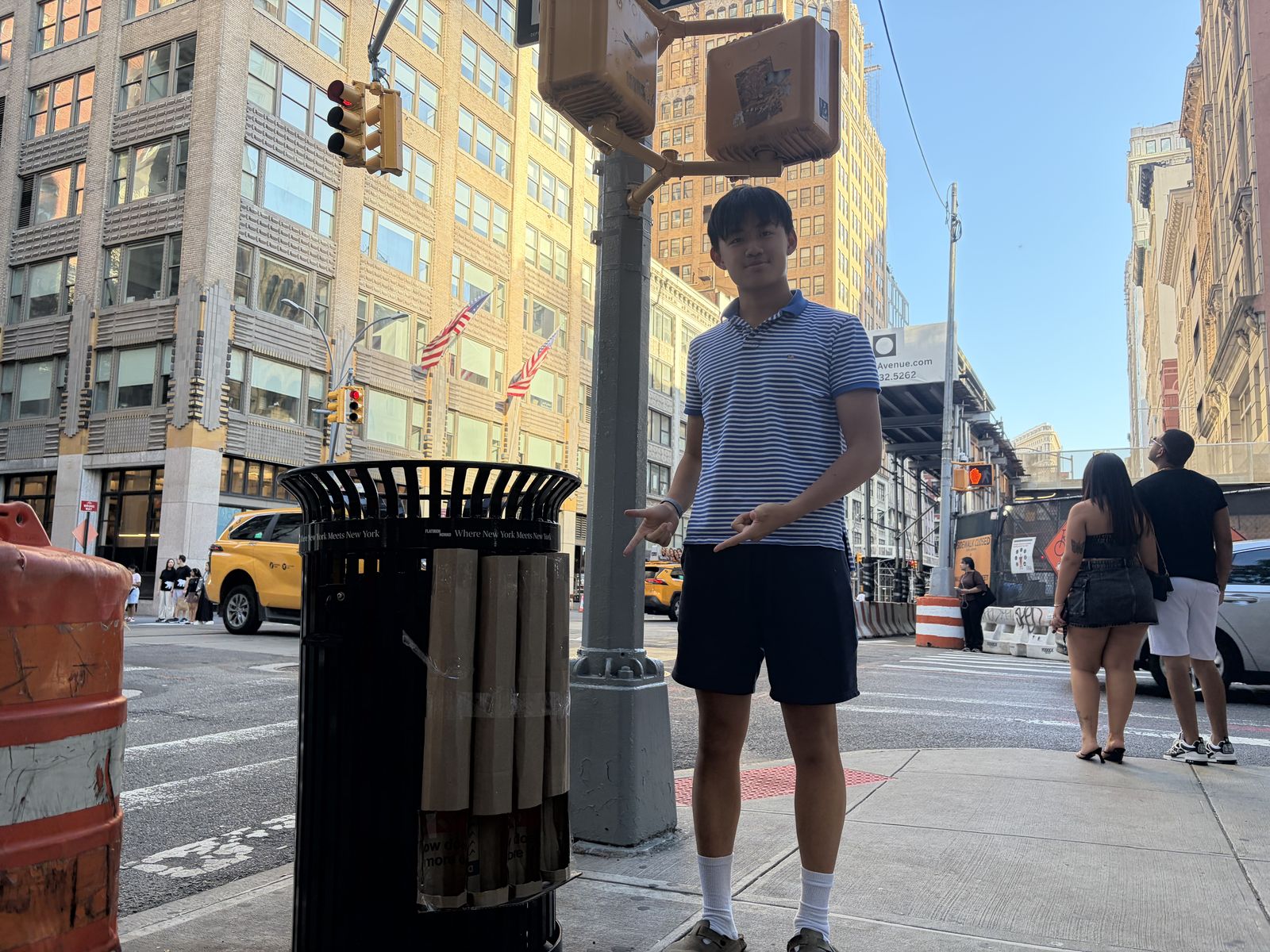 Edin Cheng standing beside the installed rack on a Manhattan corner